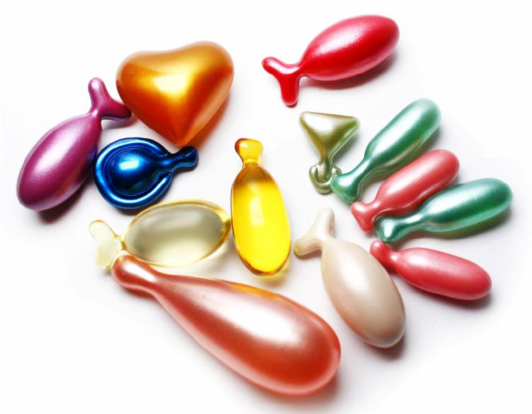 different shapes and colors of softgel capsules