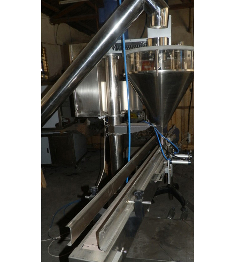 A conveyor system of auger filling machine
