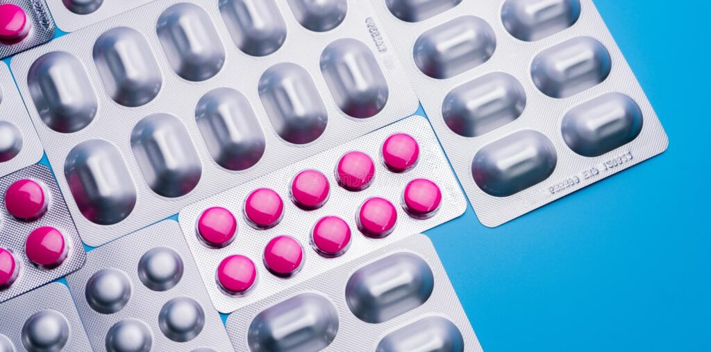 pink-tablets-blister-pack-silver-aluminium-foil capsule pills pharmaceutical-industry package