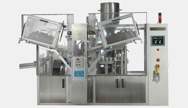 Automatic tube filling machine with two tube buckets