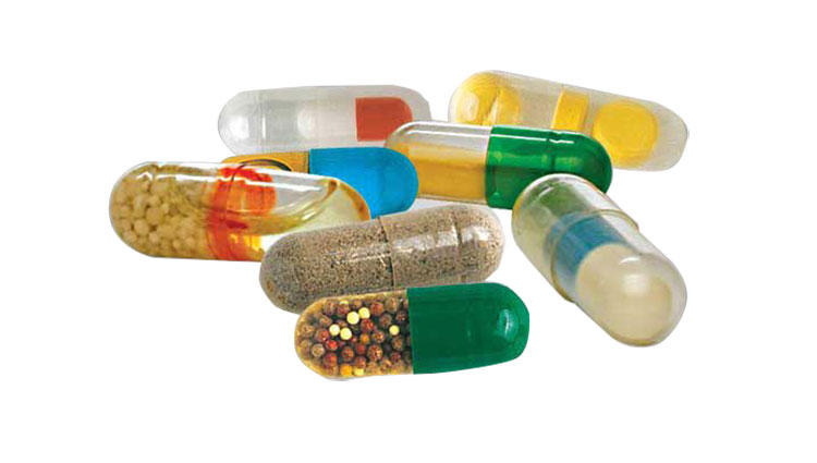 Capsules filled with smaller capsule or tablet