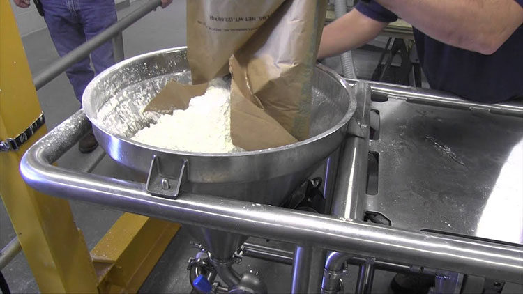 Loading the milk powder into the hopper