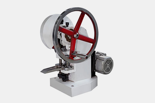 Single punch tablet press