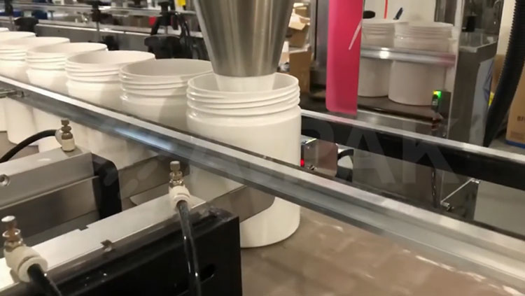 Powder filling nozzle inside bottle